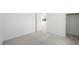 Bedroom with neutral carpet, bright white walls, a closet, and a door to another room at 633 N Water St, Henderson, NV 89015
