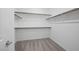 Walk-in closet with carpet, rods, and white walls at 633 N Water St, Henderson, NV 89015