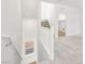 Open-concept living area featuring neutral colors, a staircase, and natural light at 633 N Water St, Henderson, NV 89015