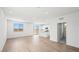 Bright and airy living room featuring wood-look floors, large windows, and an open layout at 633 N Water St, Henderson, NV 89015