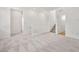 Bright living room showcasing neutral carpet, staircase and lots of natural light at 633 N Water St, Henderson, NV 89015