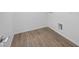 A clean utility room featuring wood-look floors at 633 N Water St, Henderson, NV 89015