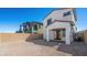 View of the backyard, featuring a covered patio, block wall and low-maintenance desert landscaping at 647 N Water St, Henderson, NV 89015