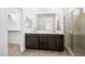 Bathroom featuring a double vanity, a glass-enclosed shower, and ample space at 647 N Water St, Henderson, NV 89015