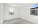 Sunlit bedroom showcasing a bright interior with neutral carpeting at 647 N Water St, Henderson, NV 89015
