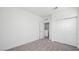 Bright bedroom features a walk-in closet and neutral carpeting at 647 N Water St, Henderson, NV 89015