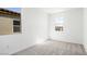 Bedroom featuring plush carpeting, ample natural light, and neutral paint, creating a soothing space at 647 N Water St, Henderson, NV 89015