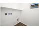 Bright laundry room with utility connections and clean white walls at 647 N Water St, Henderson, NV 89015