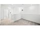 Bright upstairs loft with neutral carpeting and multiple entryways to other rooms at 647 N Water St, Henderson, NV 89015