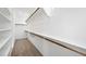 Well-organized walk-in closet with shelving and hanging rods for ample storage at 647 N Water St, Henderson, NV 89015