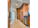 Well-lit kitchen featuring wood cabinets, stainless steel appliances, granite counters and tiled floors at 2747 Paradise Rd # 2206, Las Vegas, NV 89109