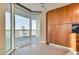 Bright kitchen featuring wood cabinets, white tiled floors and a large window with city views at 2747 Paradise Rd # 2206, Las Vegas, NV 89109