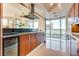 Modern kitchen featuring wood cabinets, granite counters, stainless steel appliances and a breakfast bar at 2747 Paradise Rd # 2206, Las Vegas, NV 89109