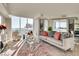 Sunlit living room featuring a comfortable sofa, cityscape views, and modern decor at 2747 Paradise Rd # 2206, Las Vegas, NV 89109