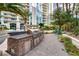 Gourmet outdoor kitchen and grill area is nestled amongst the lush greenery of the courtyard at 2747 Paradise Rd # 2206, Las Vegas, NV 89109