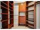 Large walk-in closet with custom wood shelving providing ample storage and organization options at 2747 Paradise Rd # 2206, Las Vegas, NV 89109