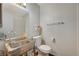 Small bathroom with toilet, sink, and shower at 537 Kristin Ln, Henderson, NV 89011