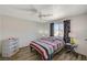 Bedroom with striped bedding and ceiling fan at 537 Kristin Ln, Henderson, NV 89011