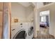 Shared laundry with washer and dryer, easily accessible from the bedroom at 537 Kristin Ln, Henderson, NV 89011
