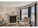 Cozy living room featuring a fireplace and a window seat at 537 Kristin Ln, Henderson, NV 89011