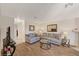 Living room with hardwood floors, gray couch, and glass coffee table at 537 Kristin Ln, Henderson, NV 89011