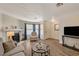 Living room with hardwood floors, fireplace, and large windows at 537 Kristin Ln, Henderson, NV 89011