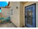 Private patio with metal gate and small table at 537 Kristin Ln, Henderson, NV 89011