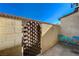 Small patio with blue metal table and chairs at 537 Kristin Ln, Henderson, NV 89011