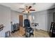 Room with tattoo equipment, flooring, and ceiling fan at 537 Kristin Ln, Henderson, NV 89011