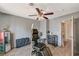 Room with tattoo equipment, flooring, and ceiling fan at 537 Kristin Ln, Henderson, NV 89011