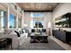 Relaxing living room with sectional sofa, large windows, and stunning view at 655 Agate Bridge St, Las Vegas, NV 89138