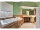 Large bathroom with a soaking tub and double vanity at 8736 Double Eagle Dr, Las Vegas, NV 89117