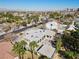 Attractive aerial view of a modern, flat-roof home with mature trees, showcasing its architectural design at 2401 Driftwood Dr, Las Vegas, NV 89107