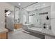 Modern bathroom featuring a standalone tub, walk-in shower, and sleek fixtures at 2401 Driftwood Dr, Las Vegas, NV 89107