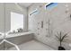 Bright bathroom showcasing a freestanding tub, rainfall shower, and modern design at 2401 Driftwood Dr, Las Vegas, NV 89107