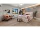 A stylish bedroom featuring a platform bed, modern decor, and lots of natural light at 2401 Driftwood Dr, Las Vegas, NV 89107