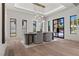 Modern dining room featuring wood floors and stylish pendant lighting at 2401 Driftwood Dr, Las Vegas, NV 89107