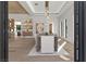 Bright dining room featuring modern light fixture, art and white walls at 2401 Driftwood Dr, Las Vegas, NV 89107