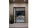 Inviting entryway featuring modern doors, neutral tones, and a glimpse of the stylish living space beyond at 2401 Driftwood Dr, Las Vegas, NV 89107
