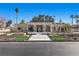 Captivating front view of modern home showcasing its elegant design, manicured landscaping, and inviting entrance at 2401 Driftwood Dr, Las Vegas, NV 89107