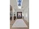 An open foyer featuring a skylight, decorative rug, and hardwood floors at 2401 Driftwood Dr, Las Vegas, NV 89107