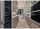 Gourmet kitchen with stainless steel appliances, custom cabinetry, and modern finishes at 2401 Driftwood Dr, Las Vegas, NV 89107
