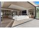 Bright open living room with a fireplace, wooden floors, built-in shelves and glass doors opening to the outside at 2401 Driftwood Dr, Las Vegas, NV 89107