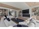 Open living room with modern furniture, a fireplace, and built in shelves at 2401 Driftwood Dr, Las Vegas, NV 89107