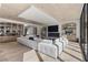 Spacious living room featuring fireplace, large windows and wood floors at 2401 Driftwood Dr, Las Vegas, NV 89107