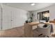Bright home office with modern desk, neutral chair, and lots of natural light at 2401 Driftwood Dr, Las Vegas, NV 89107