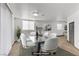 Bright dining room featuring modern glass table, seating for six, neutral walls, and natural light at 538 Kristin Ln, Henderson, NV 89011