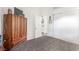 Bedroom featuring a dark wood armoire providing extra space for storage at 6201 E Lake Mead Blvd # 216, Las Vegas, NV 89156