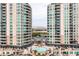 Luxury condo building with pool and surrounding landscape at 9101 Alta Dr # 1406, Las Vegas, NV 89145
