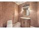 Powder room with decorative vanity and textured walls at 9101 Alta Dr # 1406, Las Vegas, NV 89145